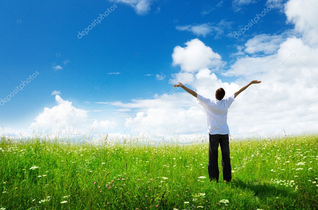 Field of grass and happy young man