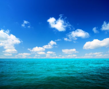 Ocean and white clouds clipart