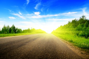 Road and sunny summer day clipart