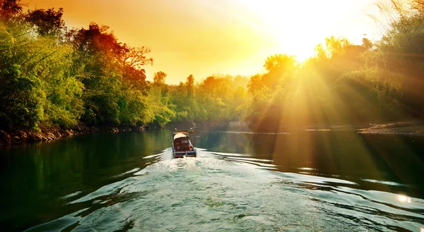 Sunset in jungle and boat — Stock Photo, Image