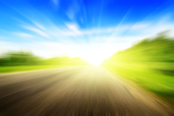 stock image Motion blur road and sun