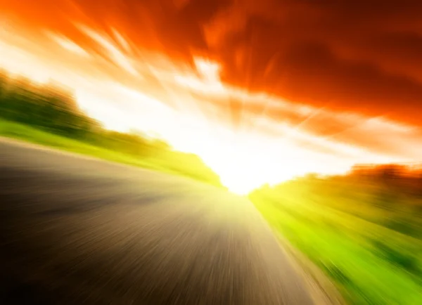 Motion blur road and sun — Stock Photo, Image