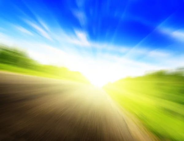 モーション ブラー道路と太陽 — ストック写真