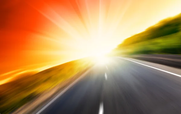 Blur estrada e sol — Fotografia de Stock