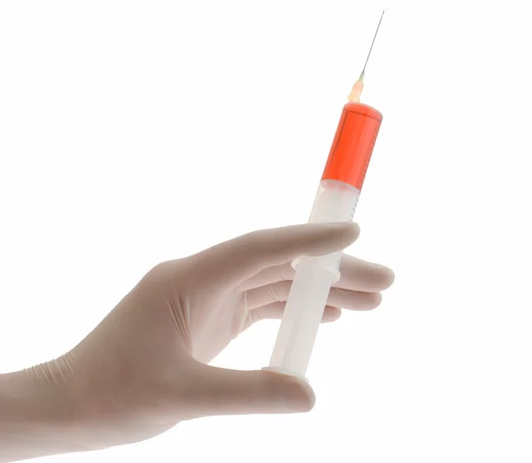 Syringe in glove of doctor — Stock Photo, Image