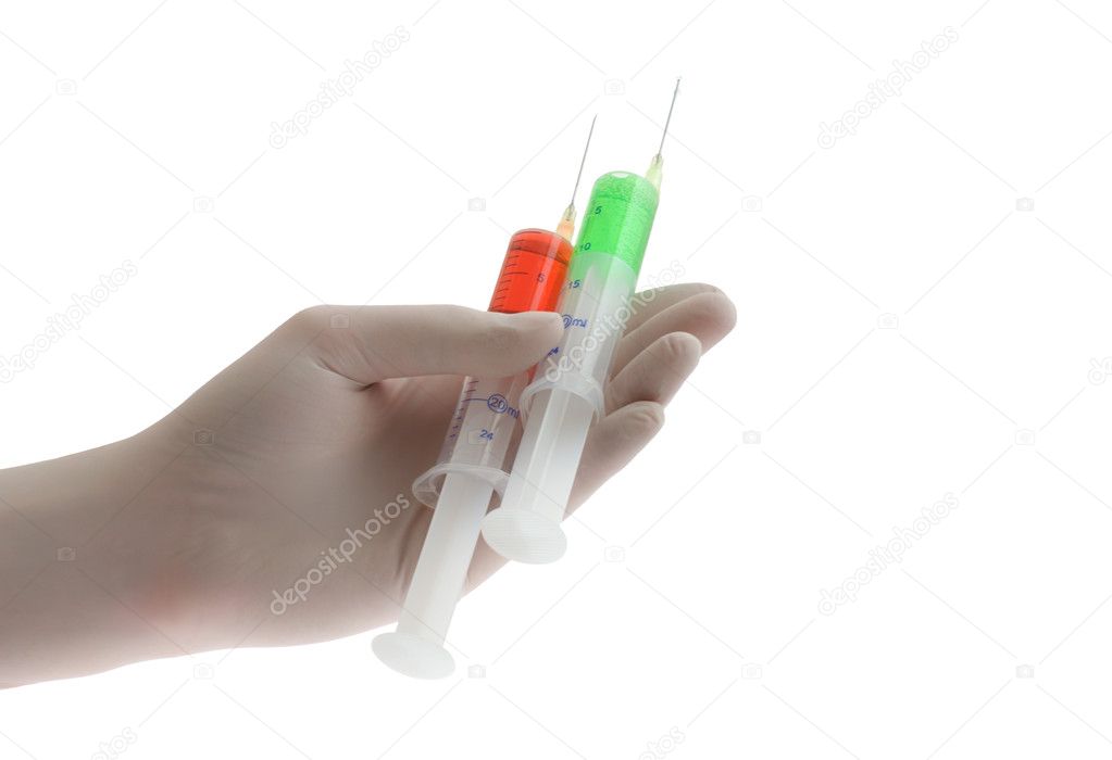 Two syringes in glove of doctor, isolated