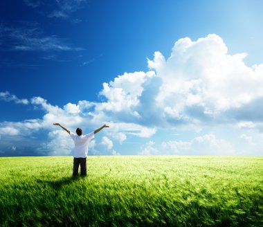 Happy young man rest on wheat field clipart