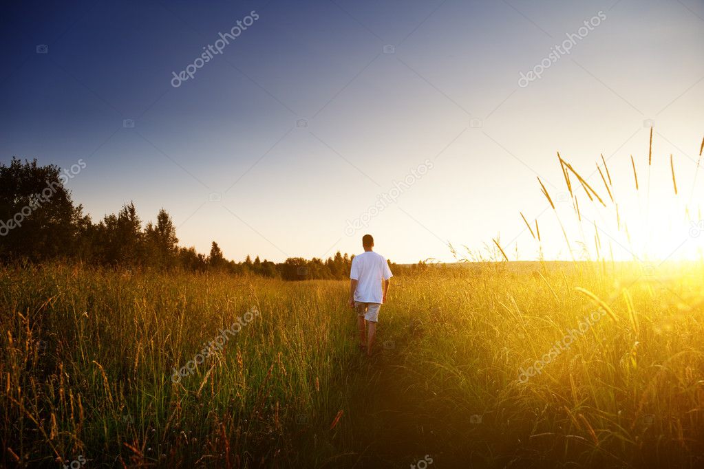 Young man walking on field