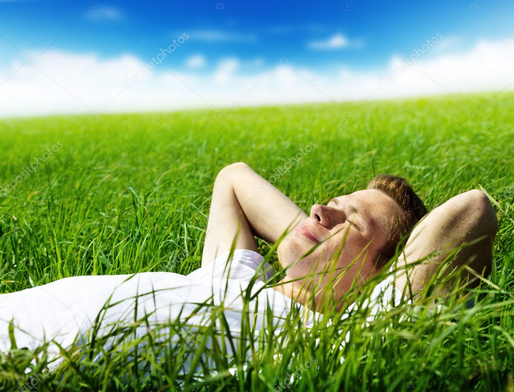 Young man in spring grass