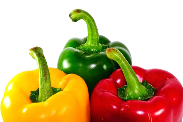 Red yellow and green sweet pepper on a white background Stock Picture