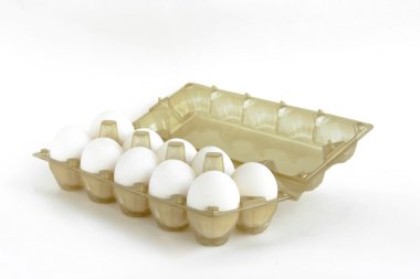 Eggs in transparent plastic packaging on a white background clipart