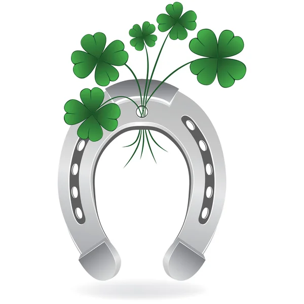 Horseshoe and four leaf clover — Stock Vector