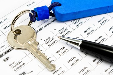 Pen, House key and Interest rates on bank loans clipart