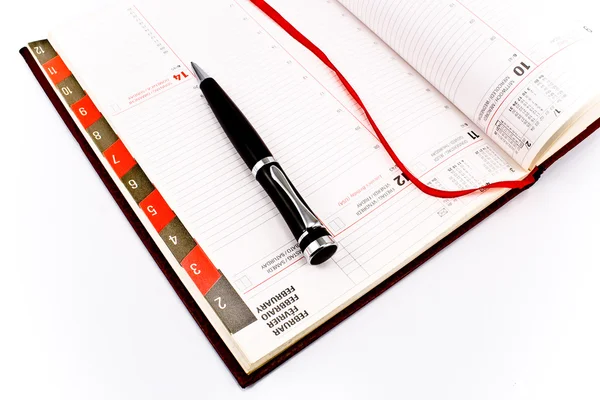 Pen on personal organizer — Stock Photo, Image