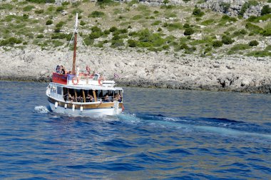 Day cruise crossing the Croatian islands towards croatia clipart