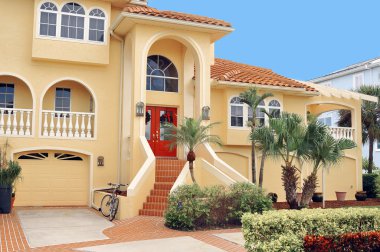Three story home in the Tropics clipart
