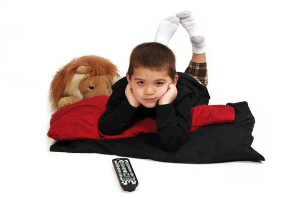 Young Boy Lounging Pillows Floor Propped Hands Watching Television — Stock Photo, Image