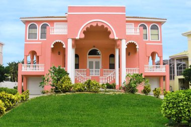 Beautiful home designed after homeland of East India. Balconies, columns, arched windows and ornate banisters give this its unique design. clipart