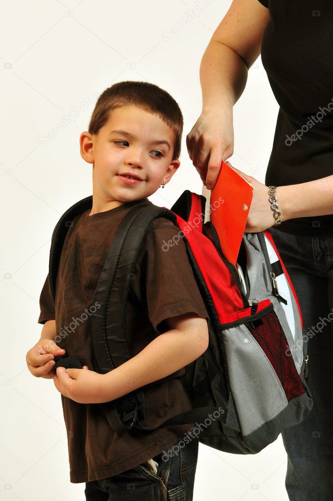 Mom getting packpack ready for son