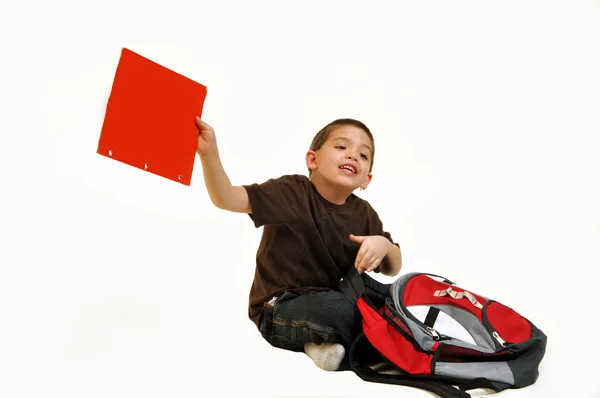 Oturma ve kırmızı klasör tutan çocuk — Stok fotoğraf