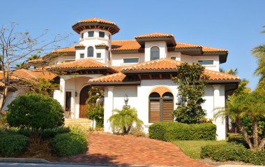 Spanish style home with tower clipart