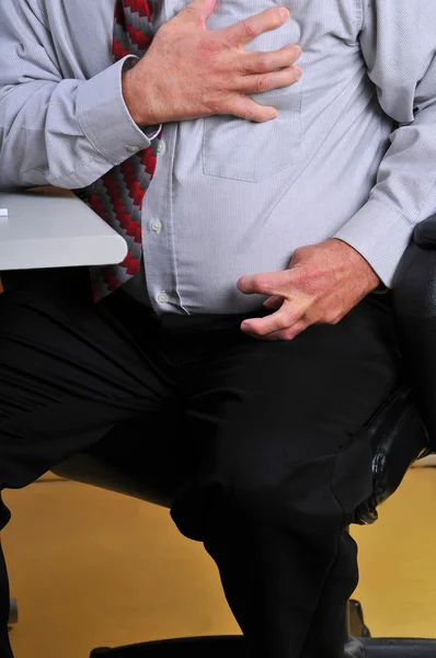 Man having heart attack at his desk — Stock Photo, Image