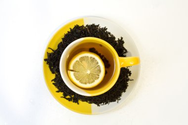 Black tea with a lemon clipart