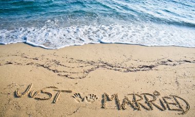 Just Married written in the Sand on the Beach clipart