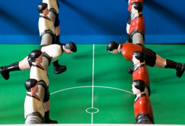 Tabletop Soccer Game with red and white figures clipart