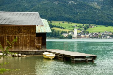 Lake Wolfgangsee in Upper Austria with wooden jetty clipart