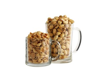 Two glass beer mugs filled with salted pistachios and nutshells clipart