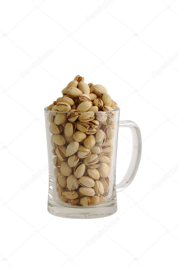 High glass beer mug filled with salted pistachios
