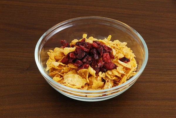 Cornflakes with dried cranberries — Stock Photo, Image