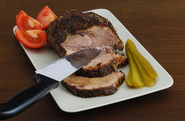 Roasted meat sliced on rectangular ceramic dish — Stock Photo, Image