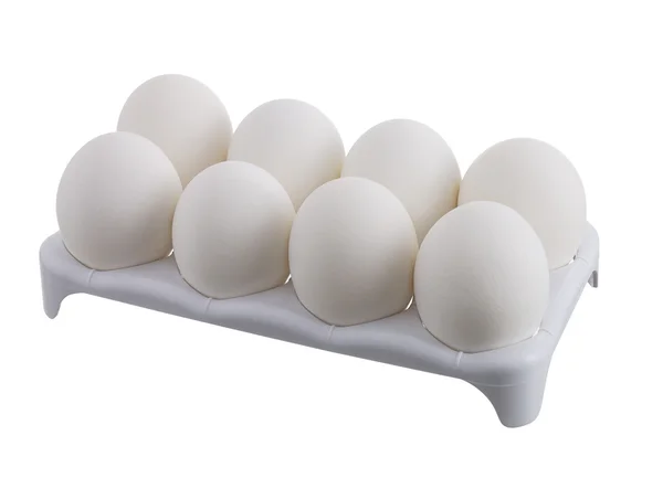 Ocho huevos blancos en caja blanca — Foto de Stock