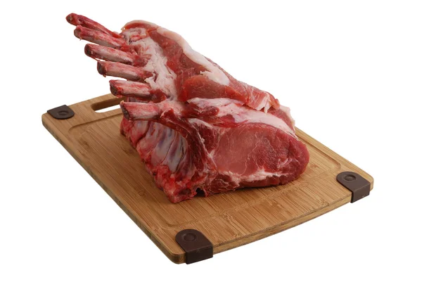 Raw pork foreloin on cutting board — Stock Photo, Image