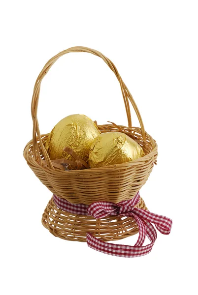 stock image Two golden eggs in straw basket