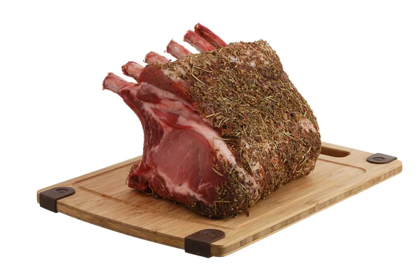 Seasoned pork foreloin on bamboo cutting board — Stock Photo, Image
