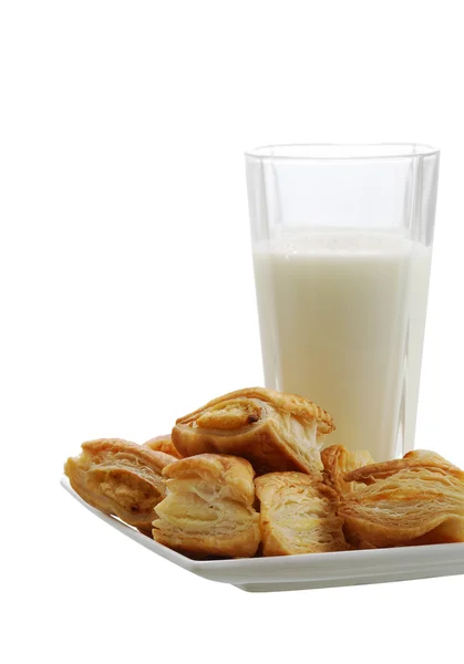 Fresh baked bourekas with glass of milk — Stock Photo, Image