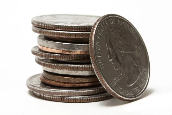 stock image US coins stacked up on a white background