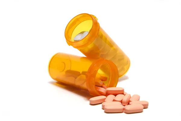 Két Üveg Kapható Tabletták Egy Ferde Más Ömlött Stock Kép
