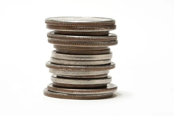 stock image Stack of coins set against a white background