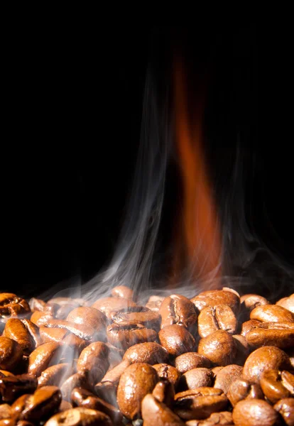 Fragrant coffee grains in a smoke — Stock Photo, Image