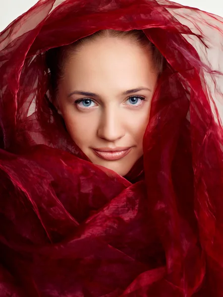 Portrait of a girl in a red chalet — Stock Photo, Image