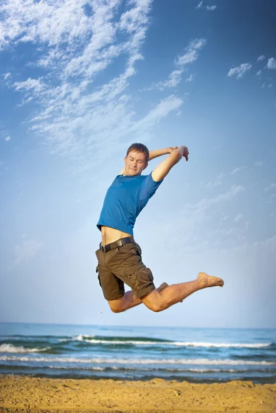 Jumping boy sea — Stock Photo, Image