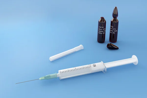 Syringe & capsules Royalty Free Stock Images