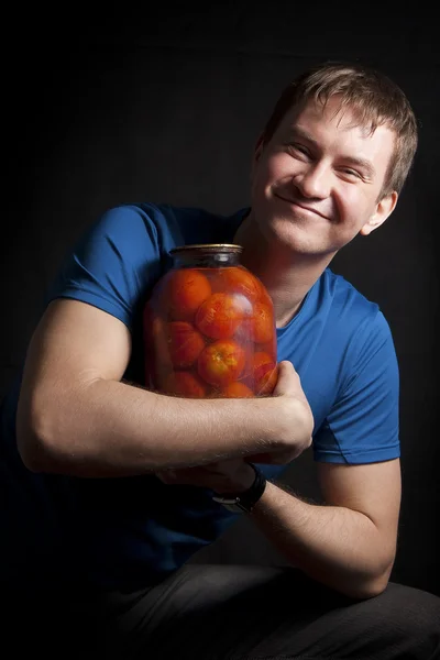 Chico con tomates Fotos de stock