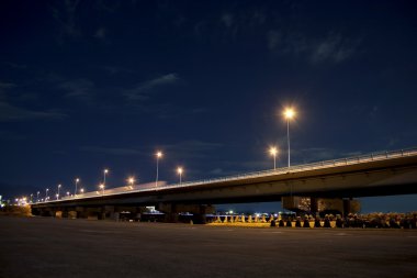 Bridge at night, cars come and go light