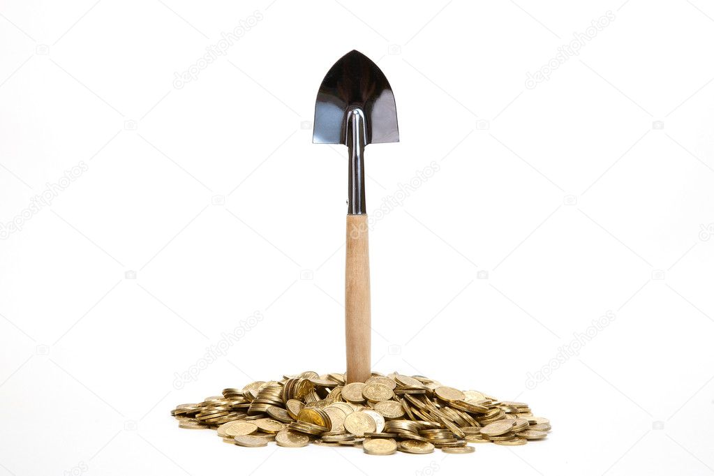 Shovel standing in pile of coins at white background
