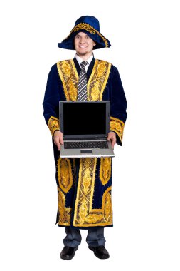Businessman in national Kazakh costume with laptop isolated on white background. Free space for text clipart